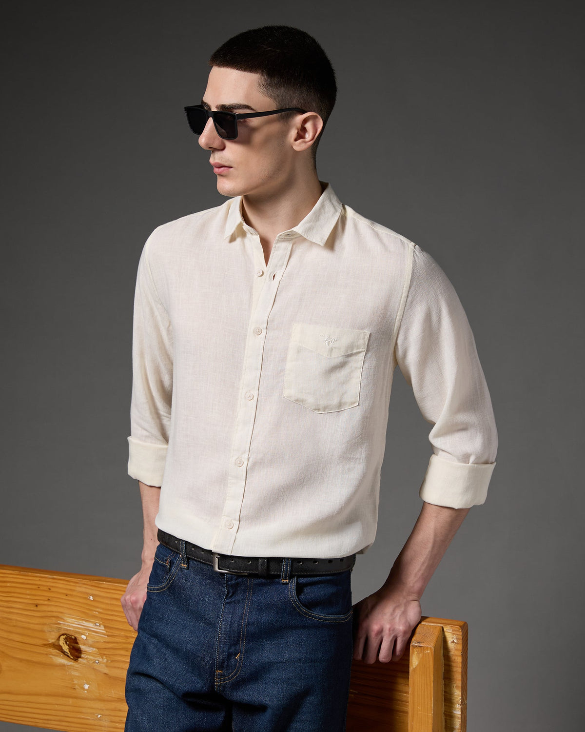 Model wearing a light grey Caddy Couture shirt.