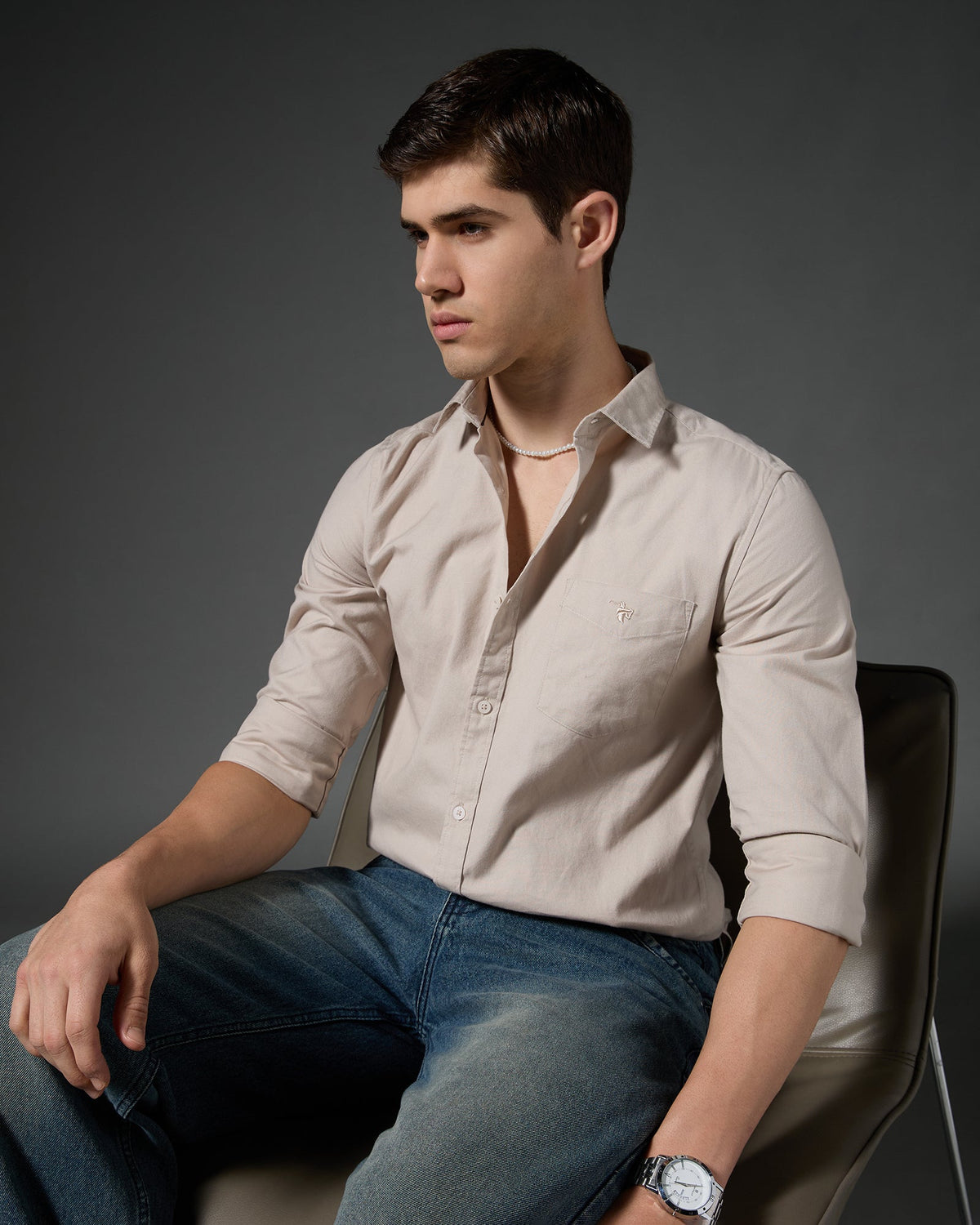 Model wearing a beige Caddy Couture shirt.